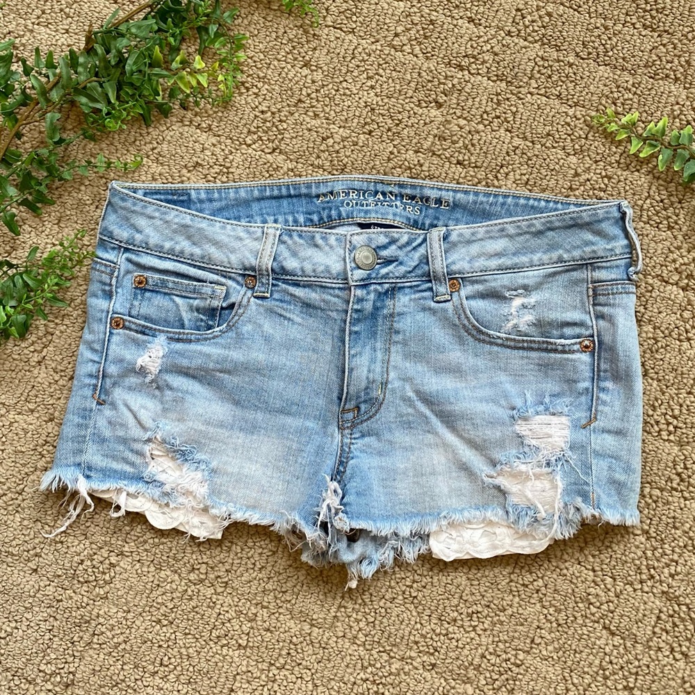 American Eagle denim shorts with lace pockets
